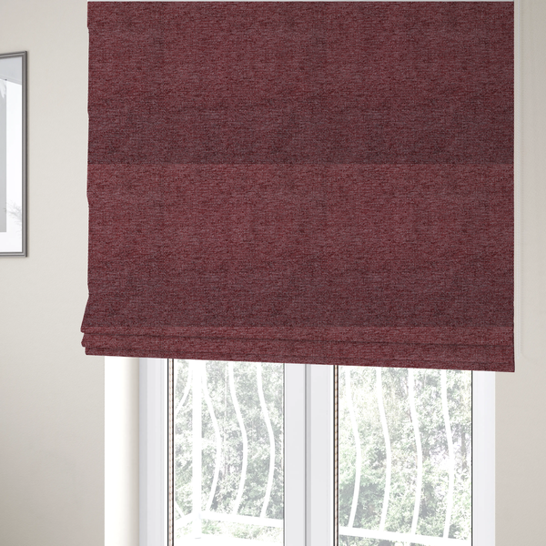 The fabric used to create these Roman blinds is a rich burgundy red woven fabric with a fine, heathered texture.