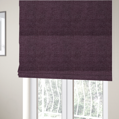 The fabric used to create these Roman blinds is a rich plum purple woven fabric with a fine, heathered texture.