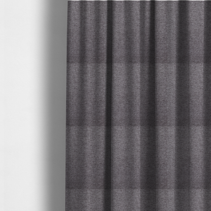 The fabric used to create these made-to-measure curtains is a charcoal grey woven fabric with a fine, heathered texture.