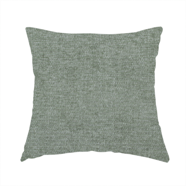 The fabric used to create this handmade cushion is a sage green woven fabric with a fine, heathered texture.