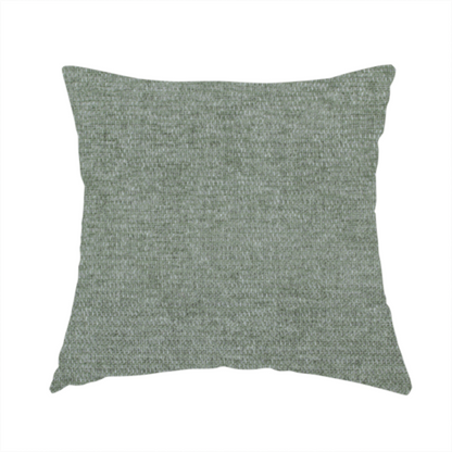 The fabric used to create this handmade cushion is a sage green woven fabric with a fine, heathered texture.