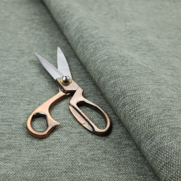 A sage green woven fabric with a fine, heathered texture.