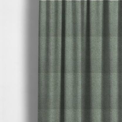The fabric used to create these made-to-measure curtains is a sage green woven fabric with a fine, heathered texture.