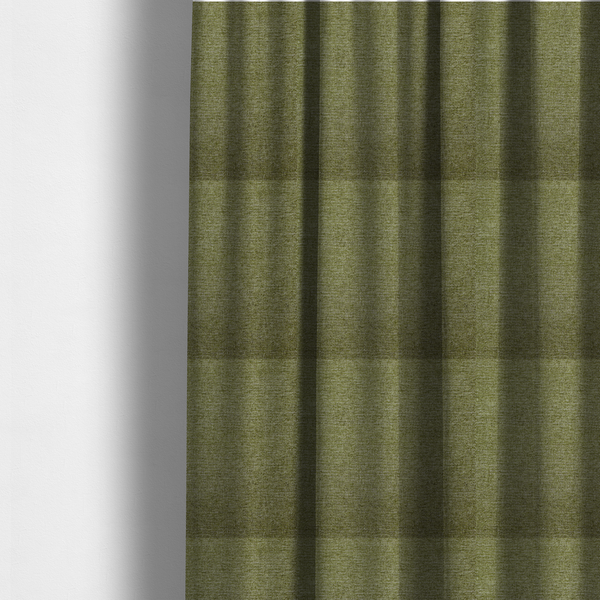 The fabric used to create these made-to-measure curtains is a rich olive green woven fabric with a fine, heathered texture.