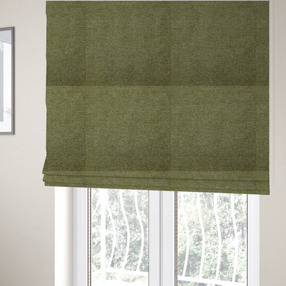 The fabric used to create these Roman blinds is a rich olive green woven fabric with a fine, heathered texture.