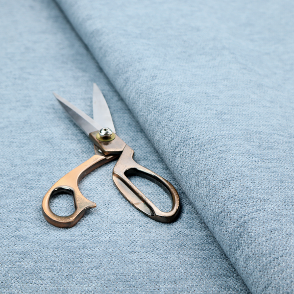 A pale powder blue woven fabric with a fine, heathered texture.