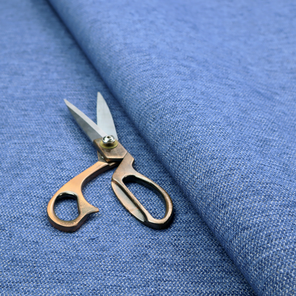 A vibrant mid-blue woven fabric with a fine, heathered texture.