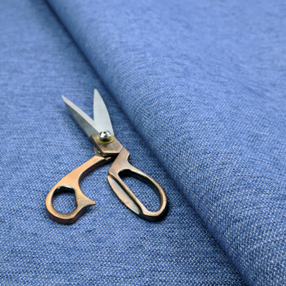 A vibrant mid-blue woven fabric with a fine, heathered texture.