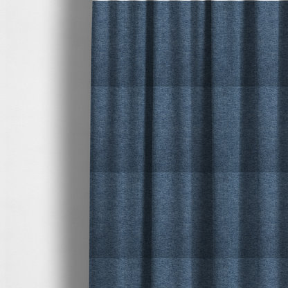 The fabric used to create these made-to-measure curtains is a dark denim blue woven fabric with a fine, heathered texture.