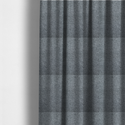 The fabric used to create these made-to-measure curtains is a charcoal grey woven fabric with a fine, heathered texture.