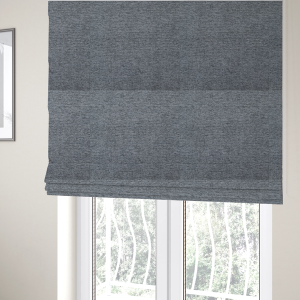 The fabric used to create these Roman blinds is a charcoal grey woven fabric with a fine, heathered texture.