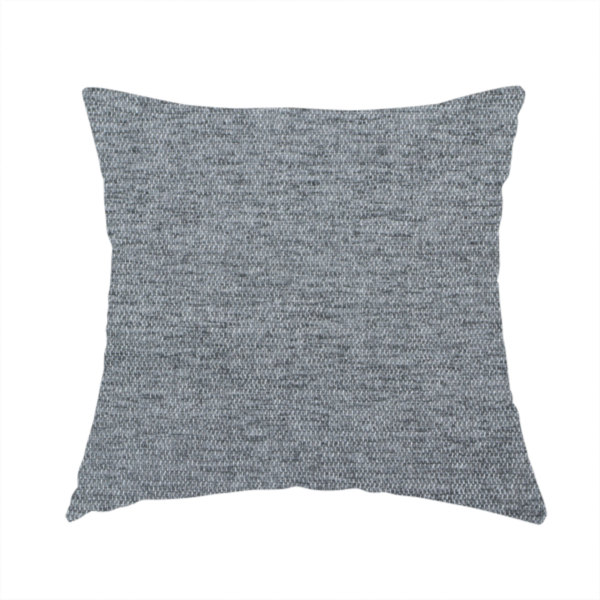 The fabric used to create this handmade cushion is a silver-grey woven fabric with a fine, heathered texture.