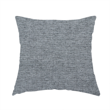 The fabric used to create this handmade cushion is a silver-grey woven fabric with a fine, heathered texture.