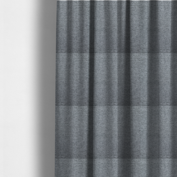 The fabric used to create these made-to-measure curtains is a silver-grey woven fabric with a fine, heathered texture.