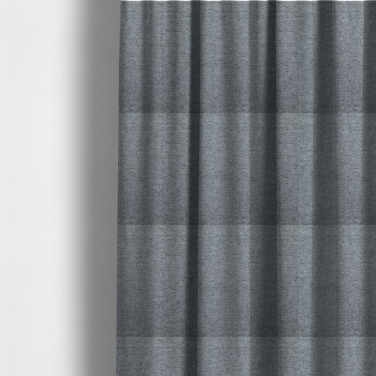 The fabric used to create these made-to-measure curtains is a silver-grey woven fabric with a fine, heathered texture.
