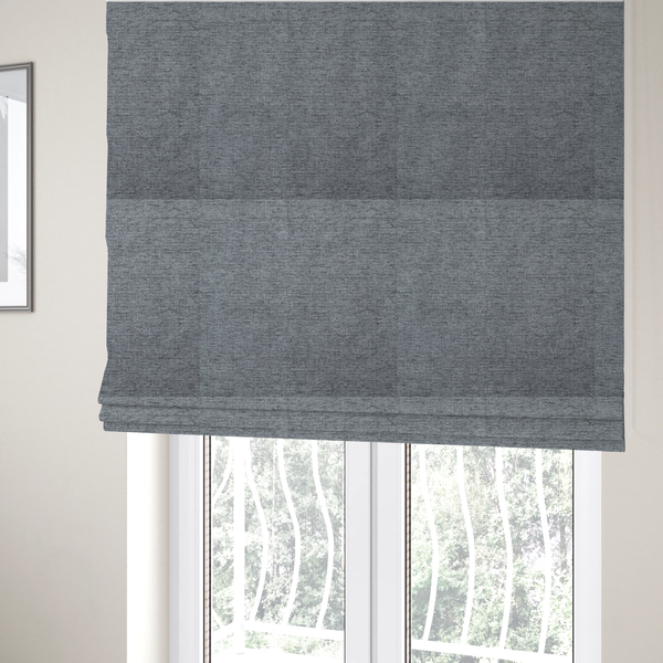 The fabric used to create these Roman blinds is a silver-grey woven fabric with a fine, heathered texture.