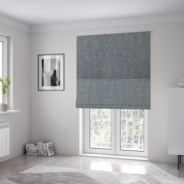 The fabric used to create these Roman blinds is a silver-grey woven fabric with a fine, heathered texture.
