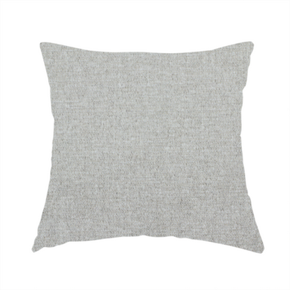 The fabric used to create this handmade cushion is a light silver-grey woven fabric with a fine, heathered texture.