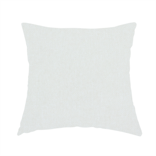 The fabric used to create this handmade cushion is a solid, off-white or light cream-coloured woven fabric. The weave appears consistent and fine, creating a subtle, clean aesthetic.