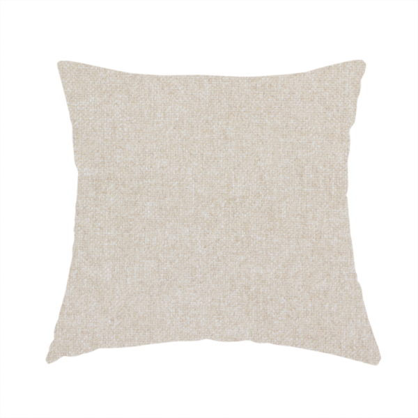 The fabric used to create this handmade cushion is a woven upholstery fabric in a warm, light beige or sand colour, featuring a consistent, textured surface pattern.