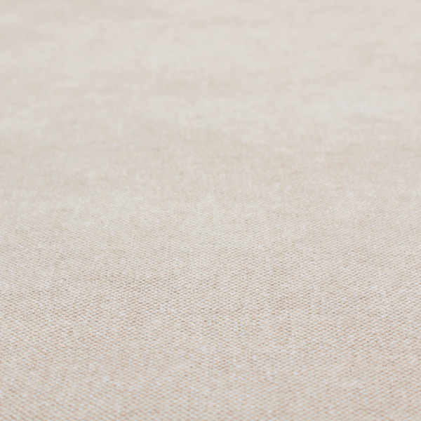 A woven upholstery fabric in a warm, light beige or sand colour, featuring a consistent, textured surface pattern.