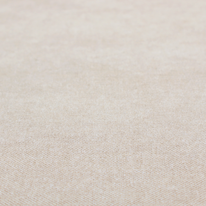 A woven upholstery fabric in a warm, light beige or sand colour, featuring a consistent, textured surface pattern.