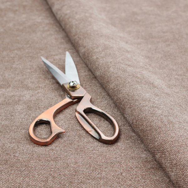 A fine, woven upholstery fabric in a rich, warm taupe or brown tone, featuring a consistent and textured surface pattern.