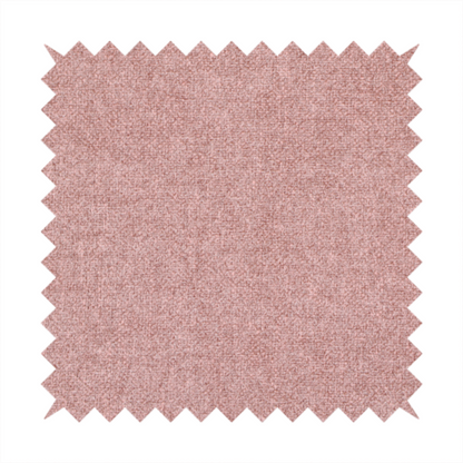 A fine, woven upholstery fabric in a soft, muted dusty pink tone, featuring a consistent and textured surface pattern.