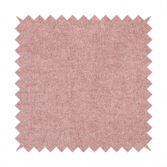A fine, woven upholstery fabric in a soft, muted dusty pink tone, featuring a consistent and textured surface pattern.