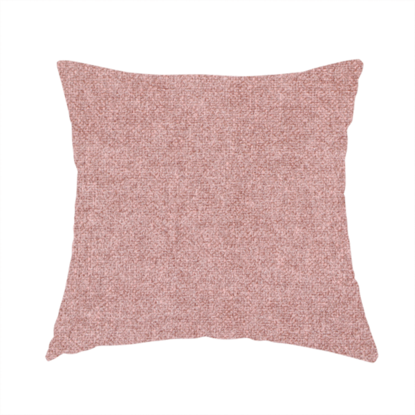 The fabric used to create this handmade cushion is a fine, woven upholstery fabric in a soft, muted dusty pink tone, featuring a consistent and textured surface pattern.