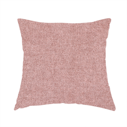 The fabric used to create this handmade cushion is a fine, woven upholstery fabric in a soft, muted dusty pink tone, featuring a consistent and textured surface pattern.