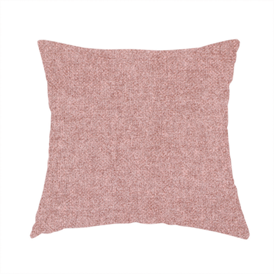 The fabric used to create this handmade cushion is a fine, woven upholstery fabric in a soft, muted dusty pink tone, featuring a consistent and textured surface pattern.