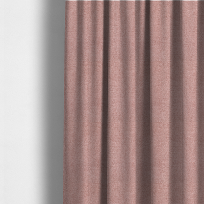 The fabric used to create these made-to-measure curtains is a fine, woven upholstery fabric in a soft, muted dusty pink tone, featuring a consistent and textured surface pattern.