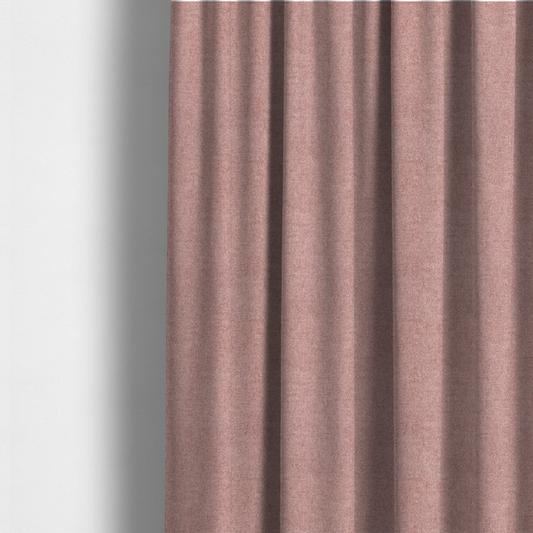 The fabric used to create these made-to-measure curtains is a fine, woven upholstery fabric in a soft, muted dusty pink tone, featuring a consistent and textured surface pattern.