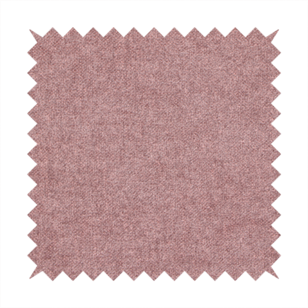A fine, woven upholstery fabric in a deep, muted mauve or dusky rose tone, featuring a consistent and textured surface pattern.