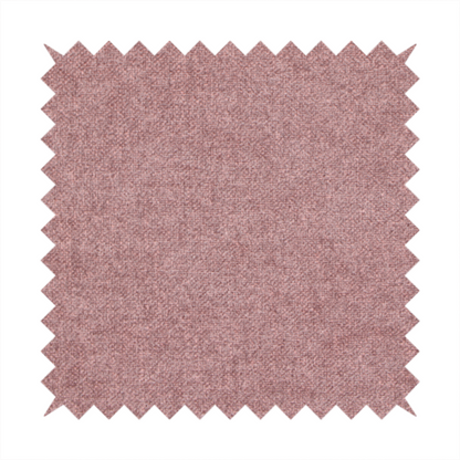 A fine, woven upholstery fabric in a deep, muted mauve or dusky rose tone, featuring a consistent and textured surface pattern.