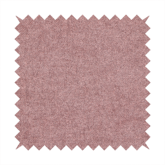 A fine, woven upholstery fabric in a deep, muted mauve or dusky rose tone, featuring a consistent and textured surface pattern.