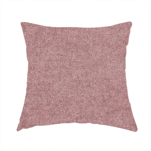 The fabric used to create this handmade cushion is a fine, woven upholstery fabric in a deep, muted mauve or dusky rose tone, featuring a consistent and textured surface pattern.
