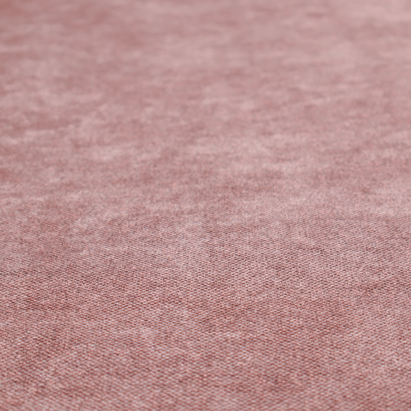 A fine, woven upholstery fabric in a deep, muted mauve or dusky rose tone, featuring a consistent and textured surface pattern.