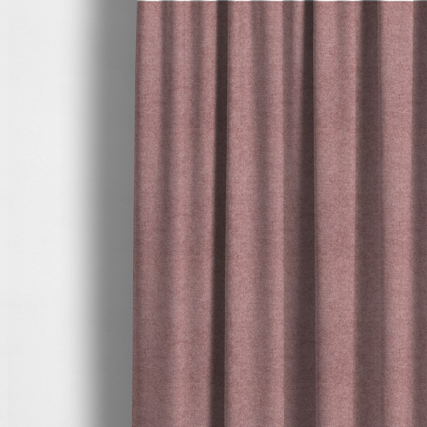 The fabric used to create these made-to-measure curtains is a fine, woven upholstery fabric in a deep, muted mauve or dusky rose tone, featuring a consistent and textured surface pattern.