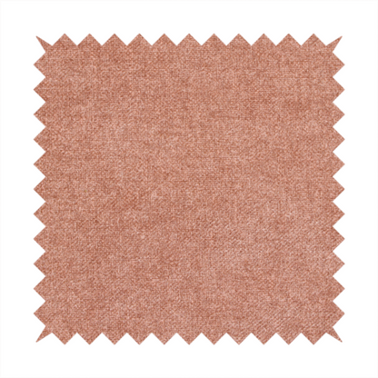 A fine, woven upholstery fabric in a warm, muted terracotta or copper tone, featuring a consistent and textured surface pattern.