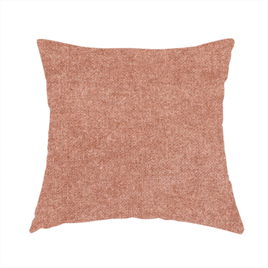 The fabric used to create this handmade cushion is a fine, woven upholstery fabric in a warm, muted terracotta or copper tone, featuring a consistent and textured surface pattern.