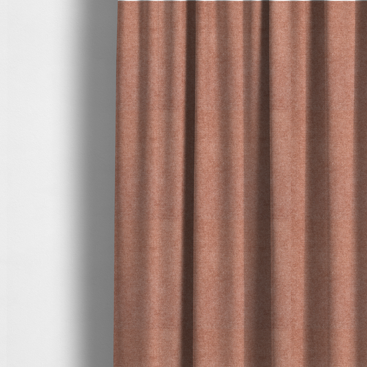 The fabric used to create these made-to-measure curtains is a fine, woven upholstery fabric in a warm, muted terracotta or copper tone, featuring a consistent and textured surface pattern.