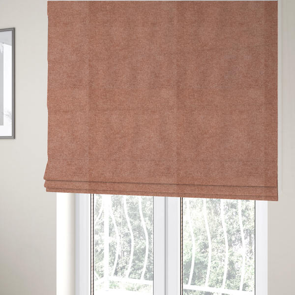 The fabric used to create these Roman blinds is a fine, woven upholstery fabric in a warm, muted terracotta or copper tone, featuring a consistent and textured surface pattern.