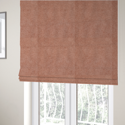 The fabric used to create these Roman blinds is a fine, woven upholstery fabric in a warm, muted terracotta or copper tone, featuring a consistent and textured surface pattern.