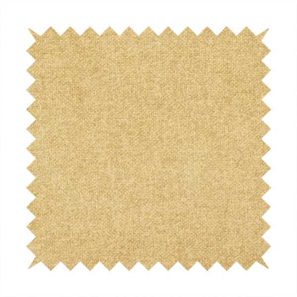 a fine, woven upholstery fabric in a warm, golden yellow or ochre tone, featuring a consistent and textured surface pattern.