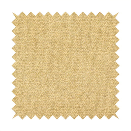 a fine, woven upholstery fabric in a warm, golden yellow or ochre tone, featuring a consistent and textured surface pattern.