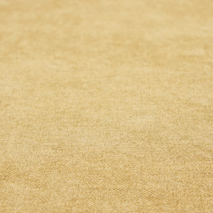 a fine, woven upholstery fabric in a warm, golden yellow or ochre tone, featuring a consistent and textured surface pattern.