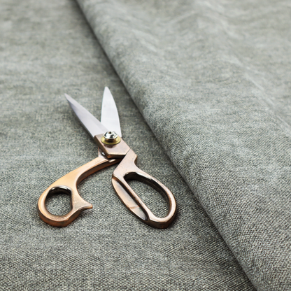 A fine, woven upholstery fabric in a cool, sophisticated slate grey tone, featuring a consistent and textured surface pattern.