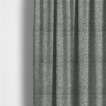 The fabric used to create these made-to-measure curtains is a fine, woven upholstery fabric in a cool, sophisticated slate grey tone, featuring a consistent and textured surface pattern.